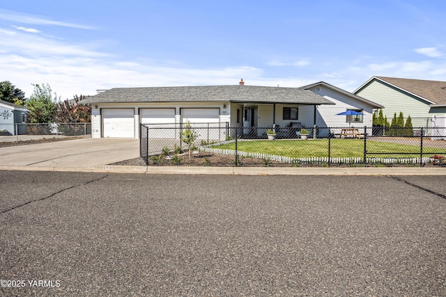 5504 Pear Butte Dr, Yakima, WA 98901 - ranch-style house with a fenced front yard, concrete driveway, and an attached garage