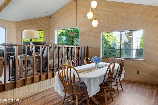 5504 Pear Butte Dr, Yakima, WA 98901 - dining area featuring wooden walls, plenty of natural light, wood finished floors, and high vaulted ceiling