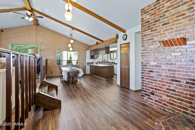 5504 Pear Butte Dr, Yakima, WA 98901 - kitchen with wooden walls, open floor plan, a ceiling fan, dark wood-style floors, and pendant lighting