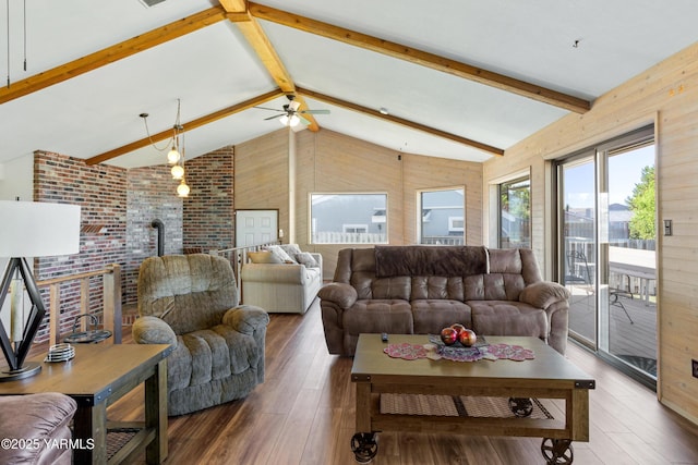 5504 Pear Butte Dr, Yakima, WA 98901 - living room with a ceiling fan, hardwood / wood-style flooring, a wood stove, wooden walls, and brick wall