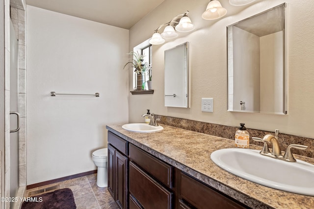 5504 Pear Butte Dr, Yakima, WA 98901 - full bathroom with double vanity, an enclosed shower, and tile patterned flooring