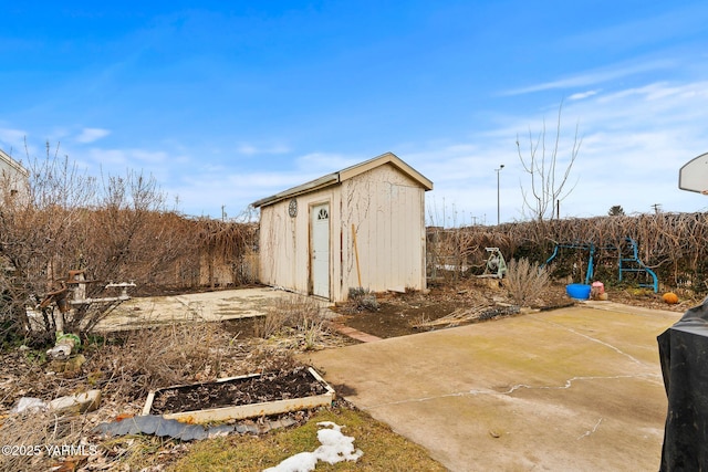 view of shed featuring fence