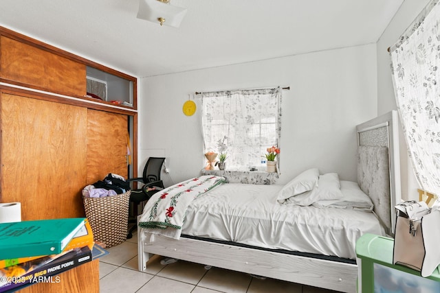 bedroom featuring light tile patterned flooring