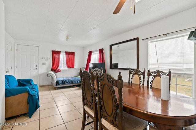 dining area featuring light tile patterned floors and ceiling fan