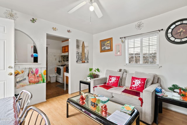 living area featuring ceiling fan and light wood-style flooring