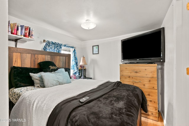 bedroom featuring wood finished floors