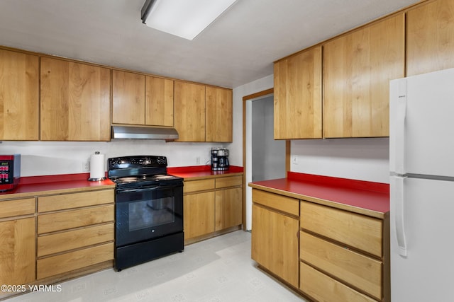 808 S 72nd Ave, Yakima, WA 98908 - kitchen featuring black range with electric stovetop, freestanding refrigerator, and under cabinet range hood