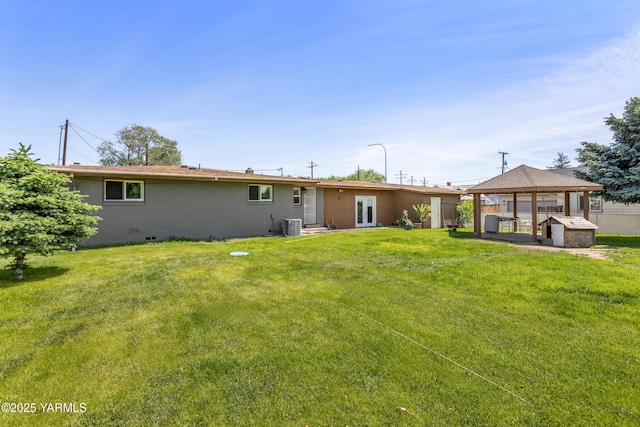 808 S 72nd Ave, Yakima, WA 98908 - rear view of property featuring a gazebo, crawl space, a lawn, and central AC