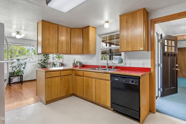808 S 72nd Ave, Yakima, WA 98908 - kitchen featuring dishwasher, a sink, light floors, and brown cabinetry