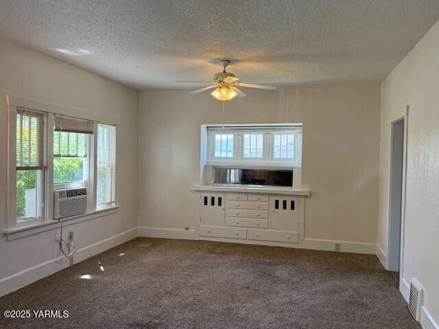 1216 S 44th Ave, Yakima, WA 98908 - empty room featuring carpet floors, a textured ceiling, ceiling fan, and baseboards
