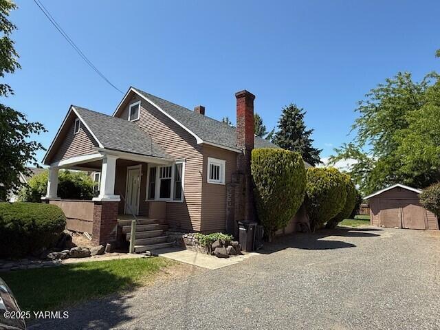 1216 S 44th Ave, Yakima, WA 98908 - bungalow with a chimney, covered porch, and a shingled roof