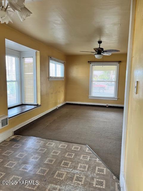 3 S Elm St, Toppenish, WA 98948 - empty room with ceiling fan, visible vents, baseboards, and carpet