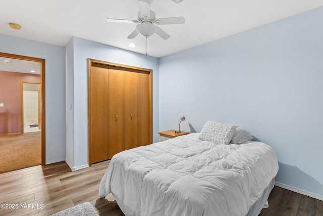 bedroom featuring recessed lighting, a closet, a ceiling fan, wood finished floors, and baseboards