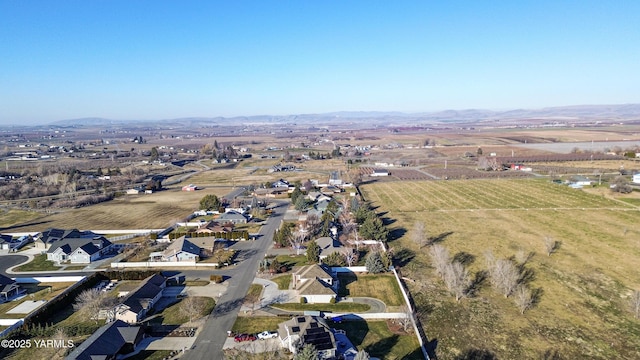 drone / aerial view with a rural view and a residential view