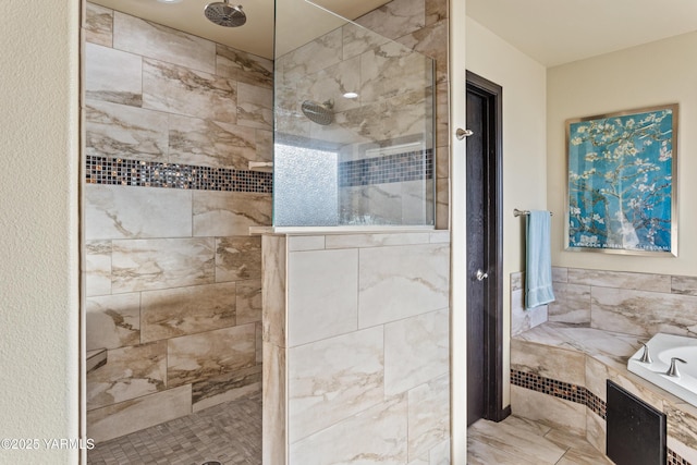 bathroom with a garden tub and walk in shower