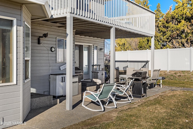 view of patio / terrace featuring fence