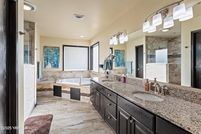 full bath with a garden tub, a stall shower, a sink, and visible vents