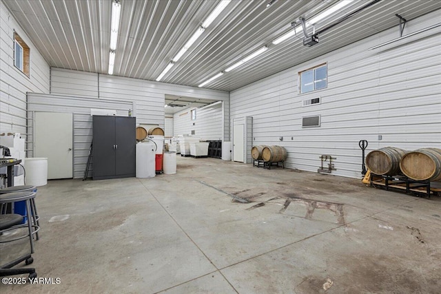 garage featuring heating fuel and metal wall