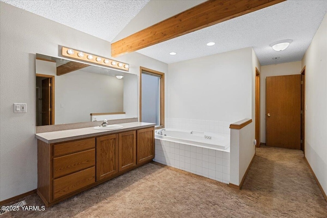 full bathroom featuring a textured ceiling, carpet, and a bath