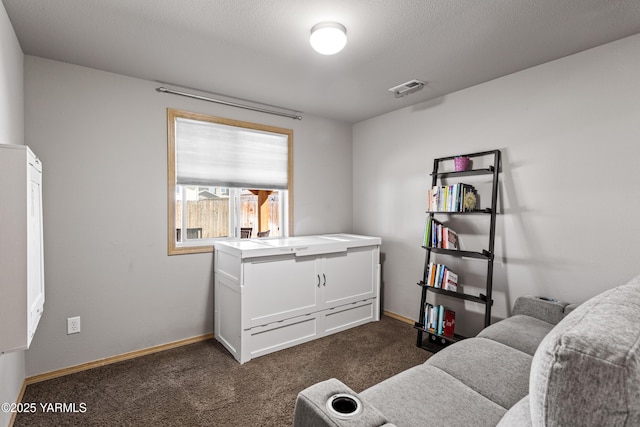 bedroom with visible vents, baseboards, and dark colored carpet