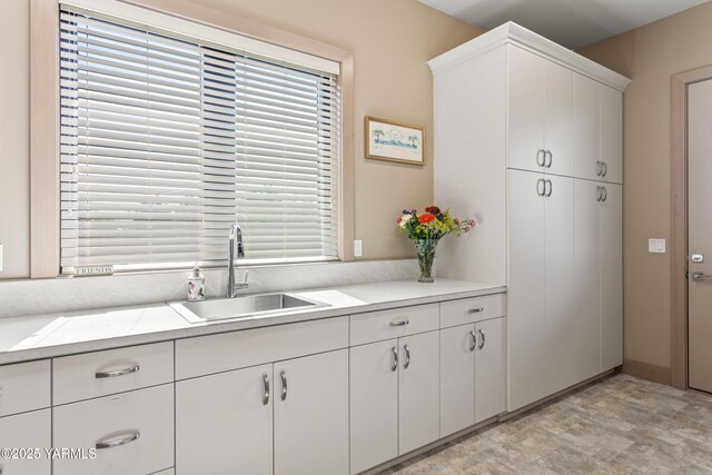 5506 Marilane St, Yakima, WA 98908 - kitchen featuring light countertops, white cabinets, and stone finish flooring