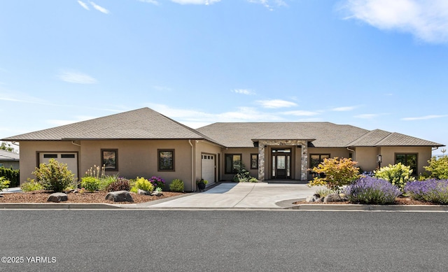 5506 Marilane St, Yakima, WA 98908 - view of front of property featuring an attached garage, driveway, and stucco siding