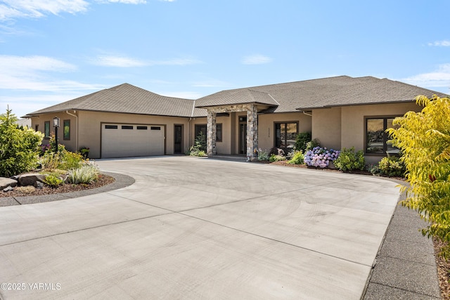 5506 Marilane St, Yakima, WA 98908 - prairie-style house with stucco siding, a garage, and curved driveway