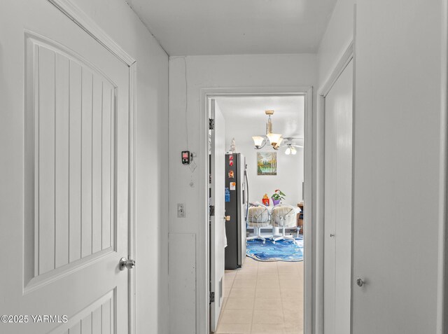 7610 Summitview Ave Unit 6, Yakima, WA 98908 - hallway with a chandelier and light tile patterned flooring