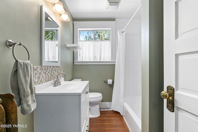 14 N 37th Ave, Yakima, WA 98902 - bathroom with vanity, decorative backsplash, shower / tub combo, and wood finished floors