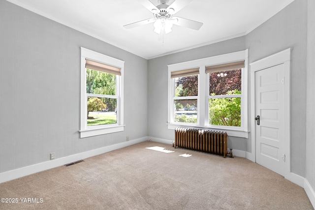 14 N 37th Ave, Yakima, WA 98902 - carpeted spare room with radiator, crown molding, and ceiling fan