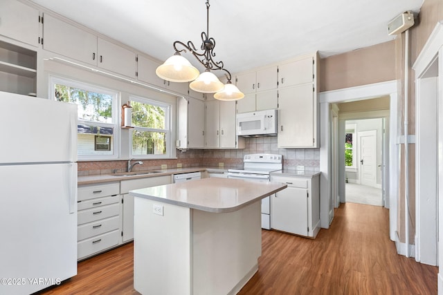 14 N 37th Ave, Yakima, WA 98902 - kitchen with white appliances, backsplash, and plenty of natural light