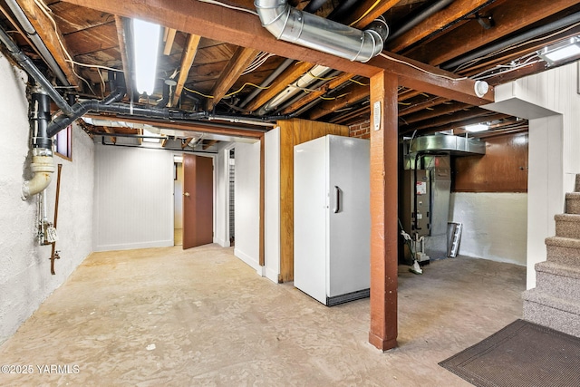14 N 37th Ave, Yakima, WA 98902 - unfinished below grade area with stairway, heating unit, and freestanding refrigerator