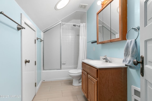 14 N 37th Ave, Yakima, WA 98902 - full bathroom with vanity, shower / bath combo with shower curtain, vaulted ceiling, and tile patterned flooring