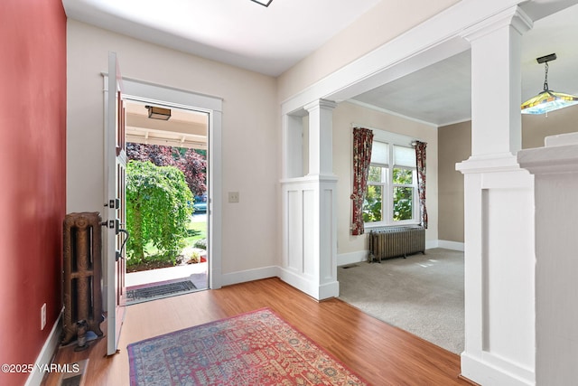 14 N 37th Ave, Yakima, WA 98902 - entrance foyer featuring decorative columns, radiator heating unit, and wood finished floors