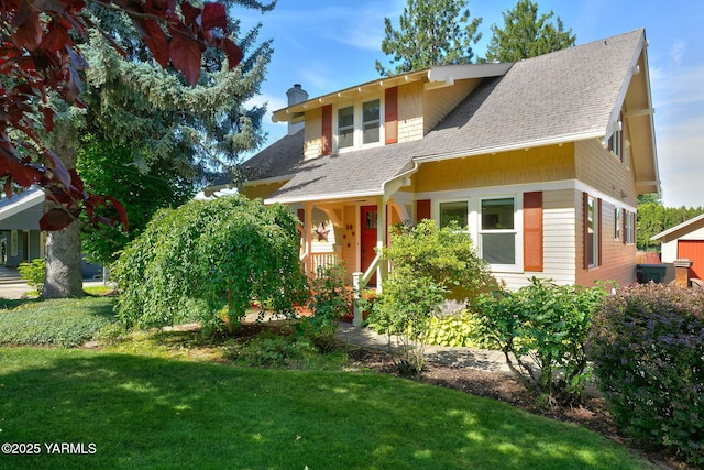 14 N 37th Ave, Yakima, WA 98902 - view of front of home featuring roof with shingles, a chimney, a front yard, and covered porch