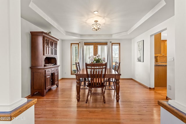 191 Alteejen Rd, Zillah, WA 98953 - dining area with baseboards, a raised ceiling, and light wood-style floors