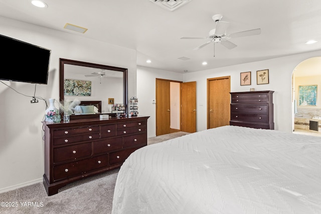 191 Alteejen Rd, Zillah, WA 98953 - carpeted bedroom with visible vents, arched walkways, baseboards, connected bathroom, and recessed lighting