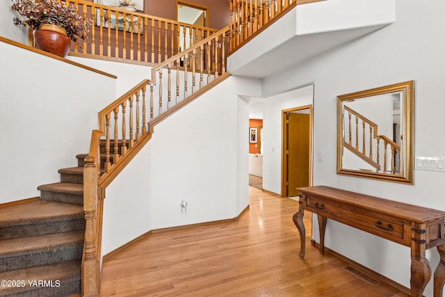 191 Alteejen Rd, Zillah, WA 98953 - stairs with baseboards, a high ceiling, wood finished floors, and visible vents