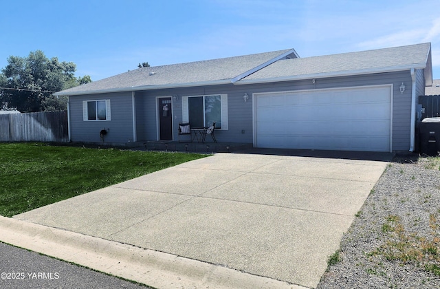 6402 Crestfields Rd, Yakima, WA 98908 - ranch-style house with a garage, driveway, and a shingled roof