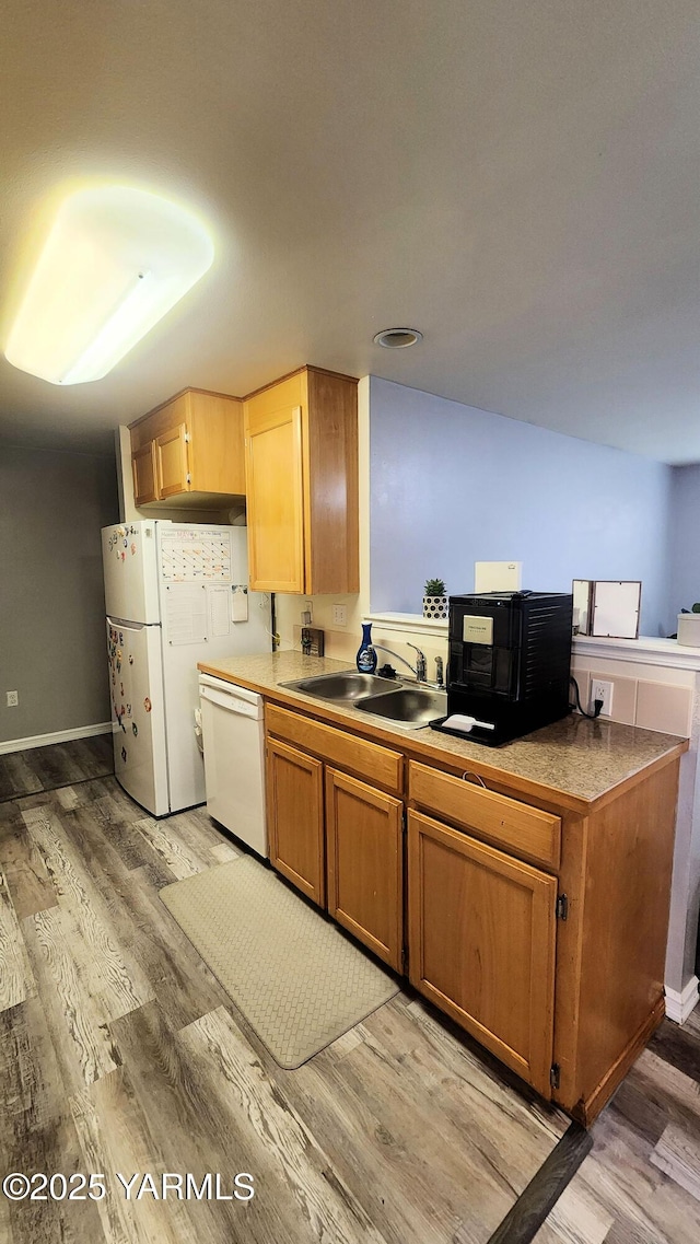 6402 Crestfields Rd, Yakima, WA 98908 - kitchen featuring white appliances, a sink, light wood-style flooring, and light countertops