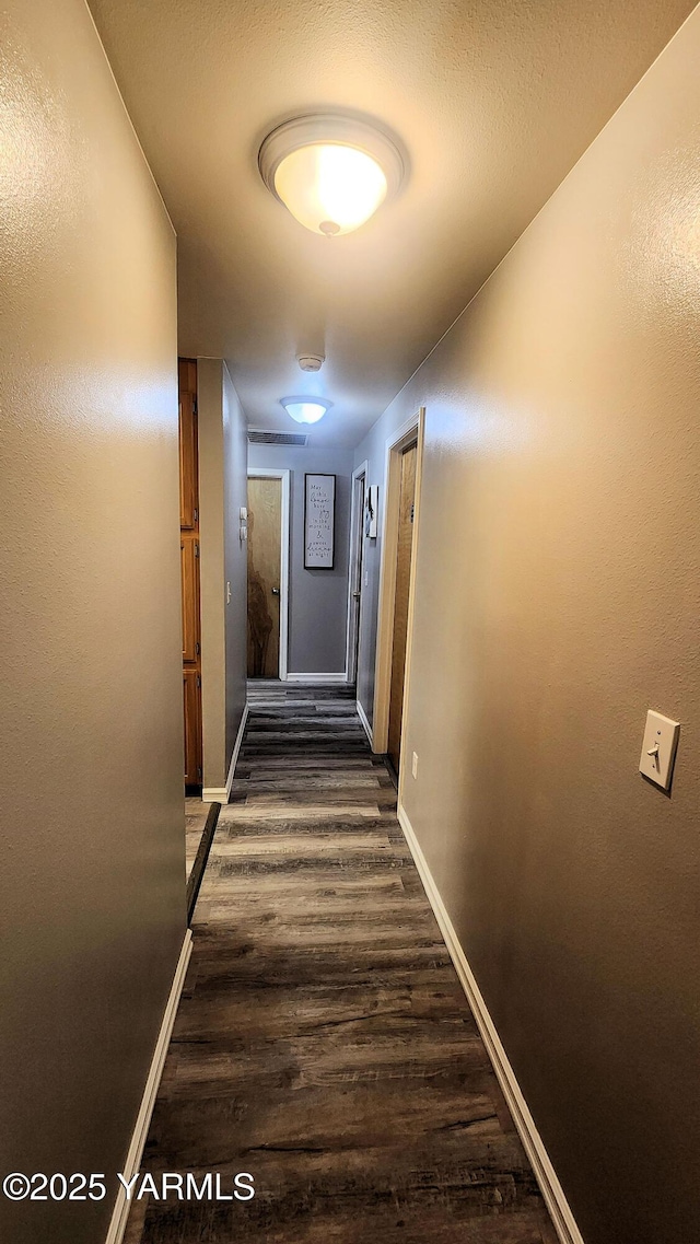 6402 Crestfields Rd, Yakima, WA 98908 - hall with dark wood-style flooring and baseboards