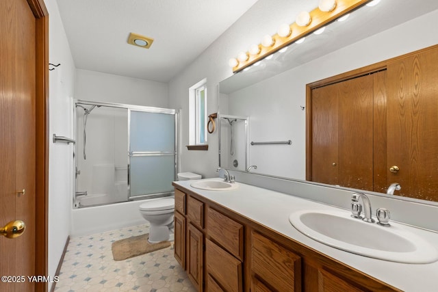 5304 Channel Dr, Yakima, WA 98901 - full bathroom with double vanity and combined bath / shower with glass door