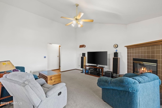 5304 Channel Dr, Yakima, WA 98901 - carpeted living area with a ceiling fan, a tile fireplace, and high vaulted ceiling