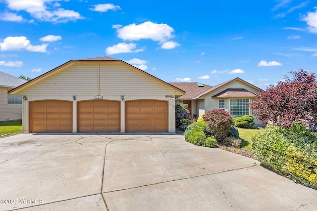 5304 Channel Dr, Yakima, WA 98901 - ranch-style home featuring driveway, an attached garage, and roof with shingles