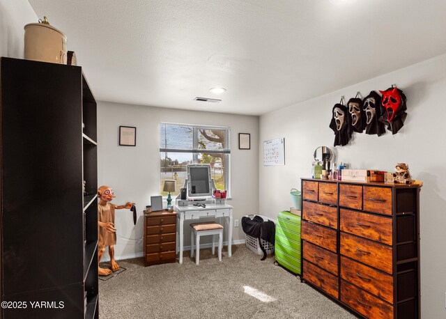 carpeted office space with baseboards