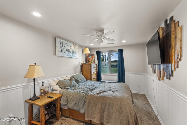 bedroom featuring wainscoting, recessed lighting, and ceiling fan