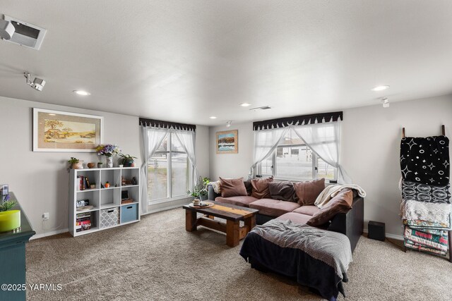 living area with carpet flooring, healthy amount of natural light, recessed lighting, and baseboards