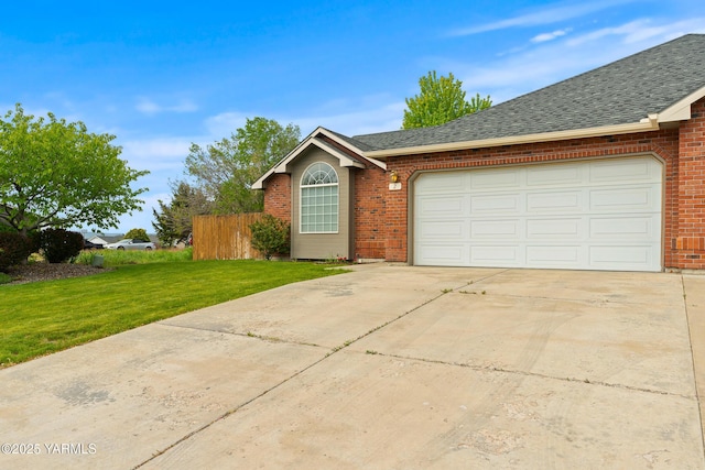 2 N 74th Ave, Yakima, WA 98908 - view of front of house featuring brick siding, an attached garage, driveway, and a shingled roof