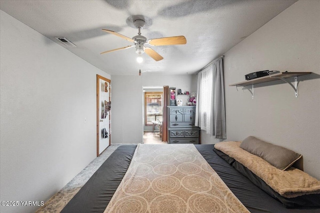 101 W Slavin Rd, Yakima, WA 98903 - bedroom with carpet floors, a ceiling fan, and a textured ceiling