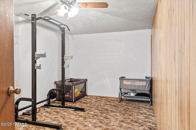 101 W Slavin Rd, Yakima, WA 98903 - workout room featuring carpet floors, a ceiling fan, and a textured ceiling